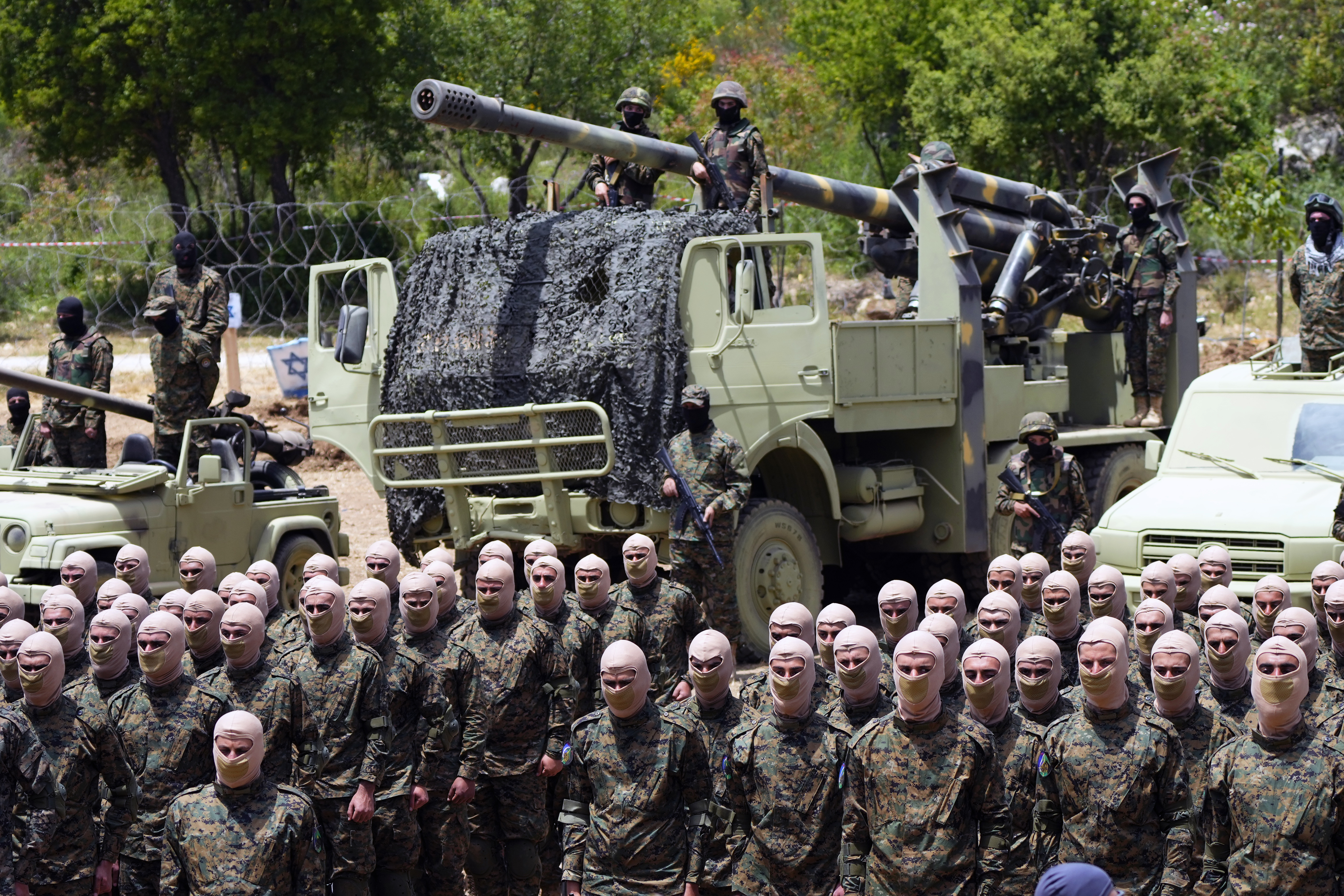Hezbollah fighters carry out a training exercise in Aaramta village in the Jezzine District of Lebanon