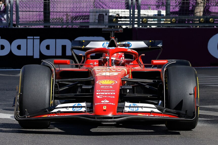 Charles Leclerc in his F1 Ferrari, driving on the Baku street circuit