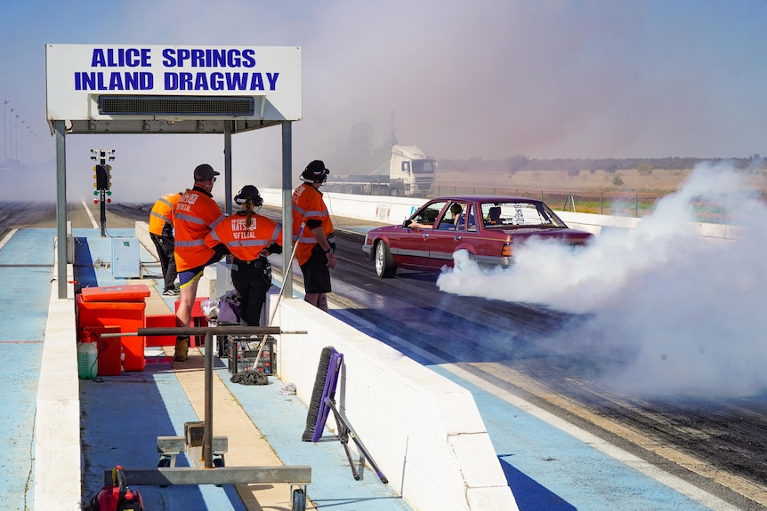 A car takes off on a dragway