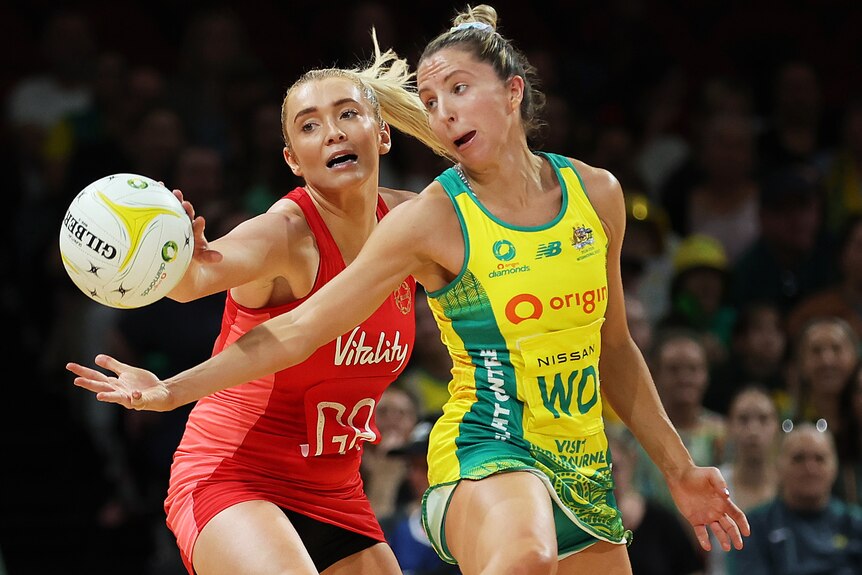 Helen Housby and Amy Parmenter challenge for the ball.