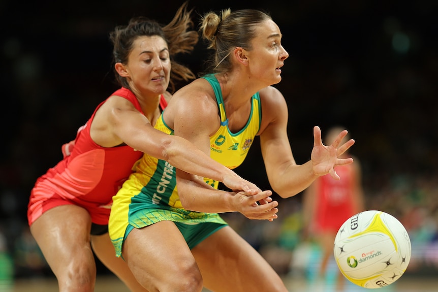 Liz Watson and Beth Cobden compete for the ball during the Australia vs England netball second Test.