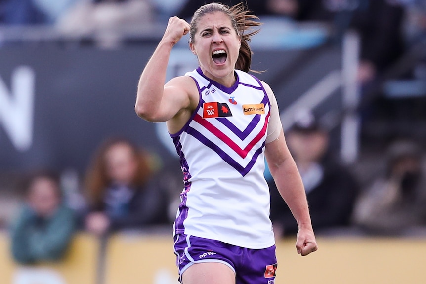 Gaby O'Sullivan celebrates a Dockers AFLW goal.