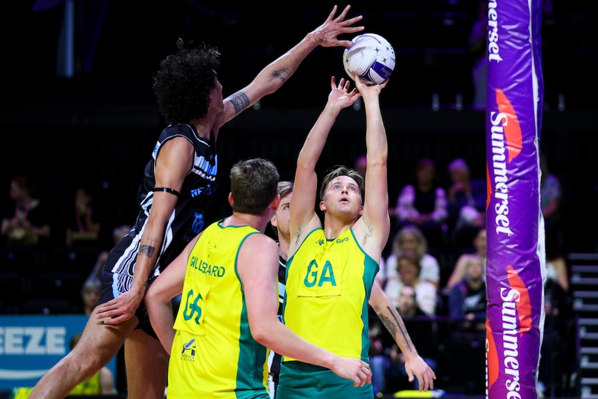 Brodie Roberts has a shot on goal for Australia against New Zealand in the men's netball Test.