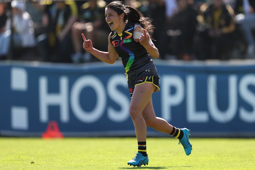 Emelia Yassir celebrates a Richmond AFLW goal.