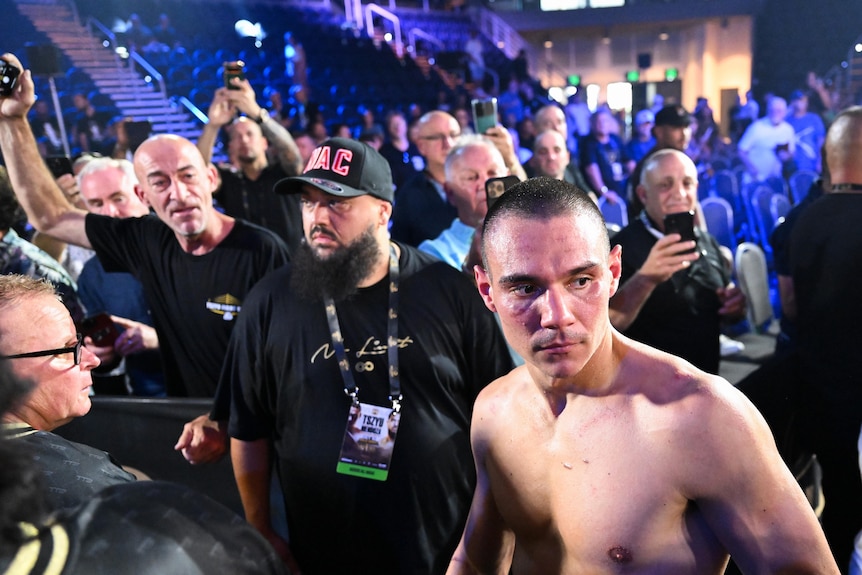Tim Tszyu walks to the ring