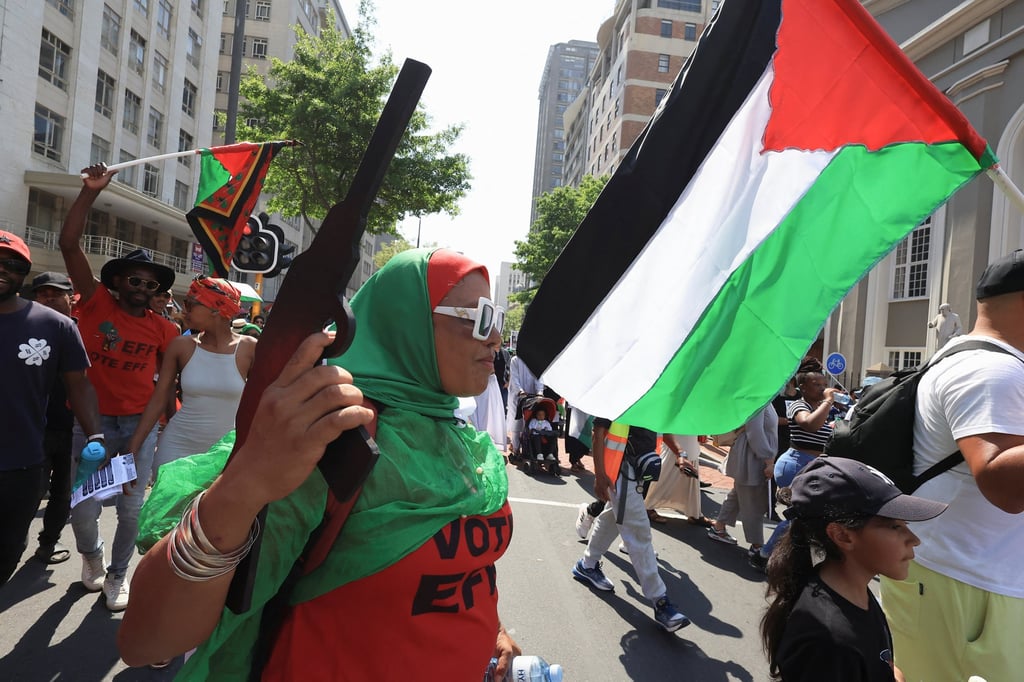 A person holds a makeshift weapon during a protest to show support for Palestinians in Gaza, in Cape Town, South Africa on Saturday. Photo: Reuters