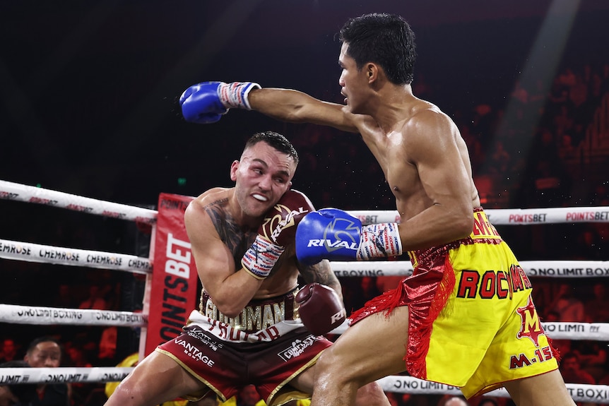 Sam Goodman ducks a punch