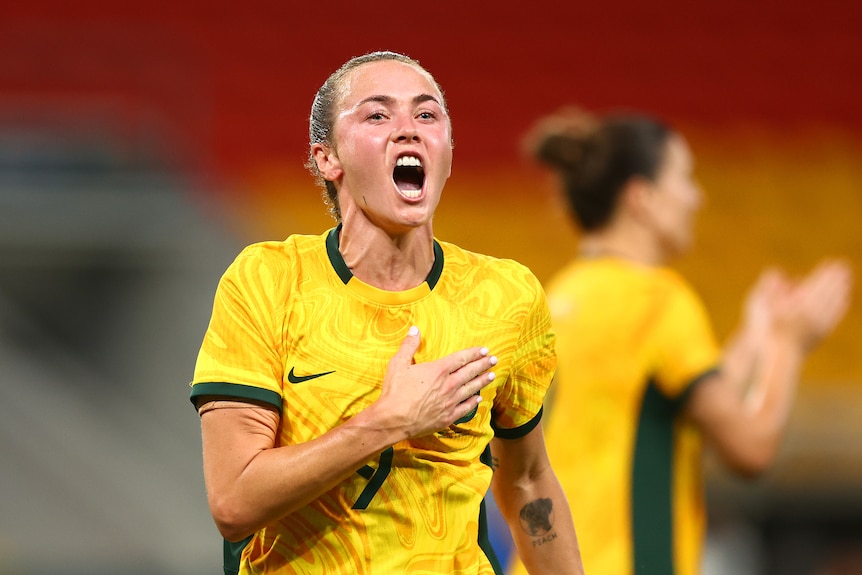 Caitlin Foord slaps her chest
