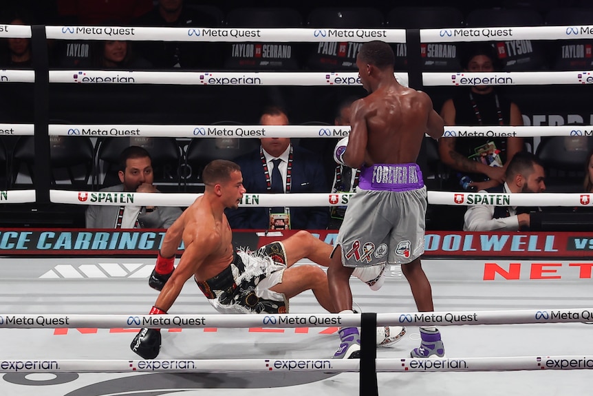 Dana Coolwell is knocked down by Bruce Carrington