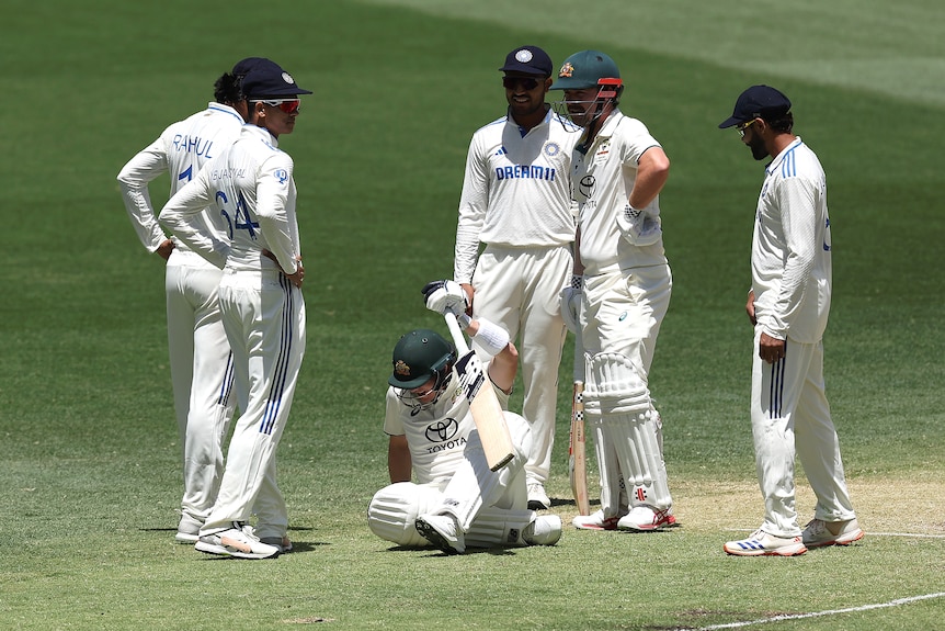 Steve Smith lies on the ground