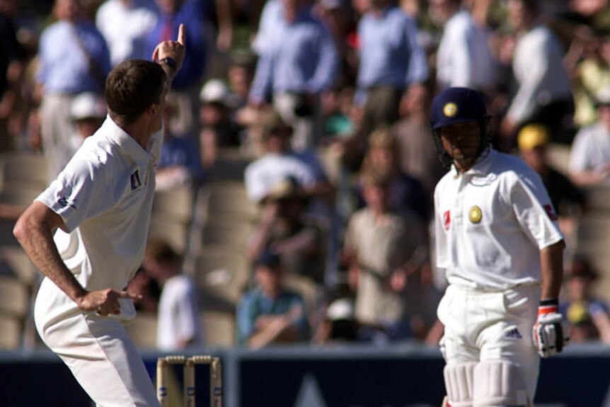 Glenn McGrath celebrates in front of Sachin Tendulkar