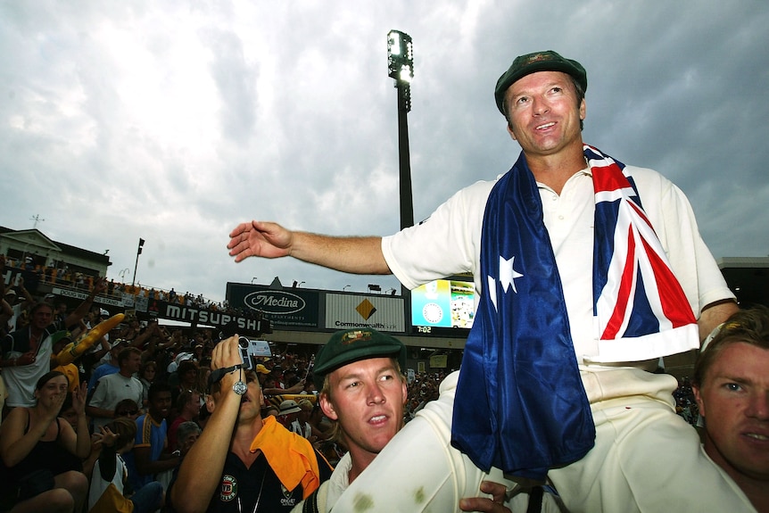 Steve Waugh with an Australia flag around his shoulders