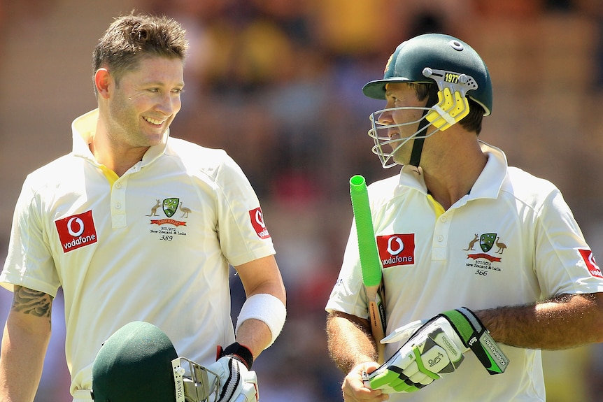 Michael Clarke walks next to Ricky Ponting