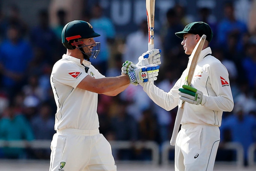 Shaun Marsh celebrates his 50 with Peter Handscomb