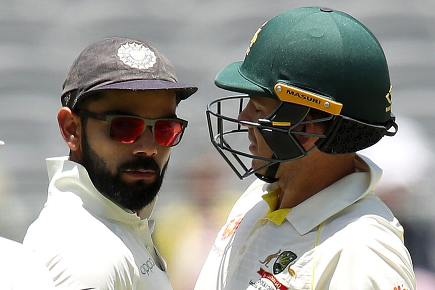 Virat Kohli and Tim Paine chest bump