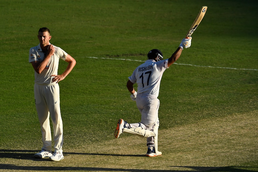 Rishabh Pant runs with his bat in the air