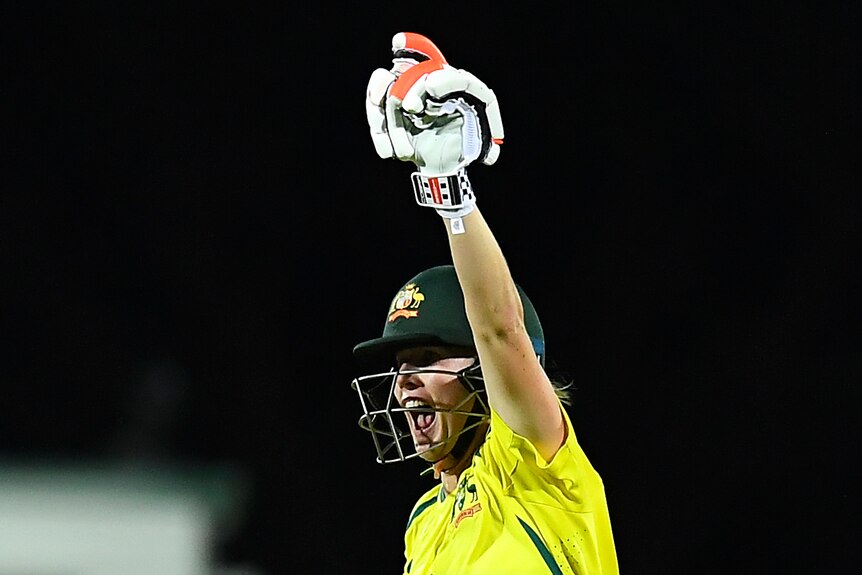 Beth Mooney celebrates with her arm up in the air