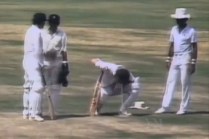 Players gather around Dean Jones (second from right) as he vomits during a Test innings in Chennai in 1986.
