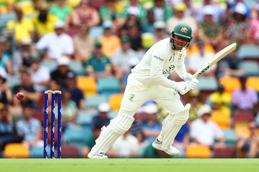 Australia batter Usman Khawaja takes off for a run during a cricket Test against India.