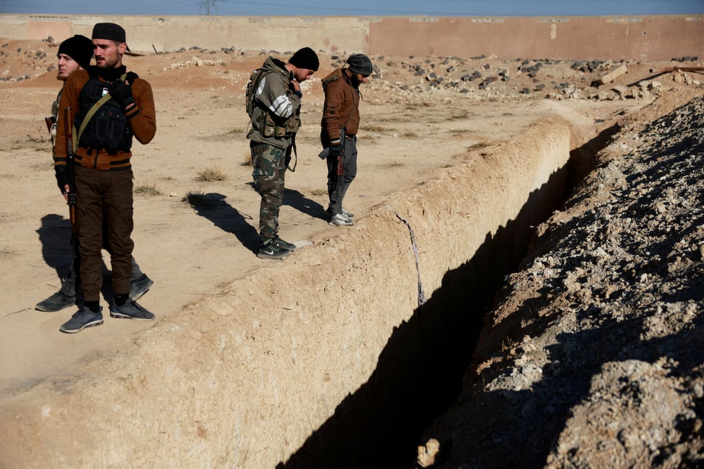 The site of a mass grave in Najha, Syria. Photo: Reuters