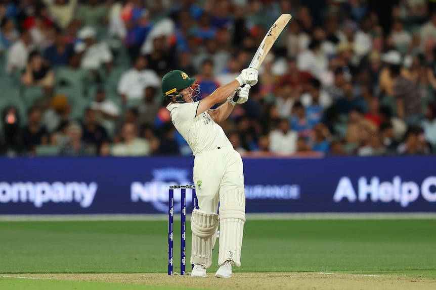 Nathan McSweeney holds his bat high as he completes a pull shot