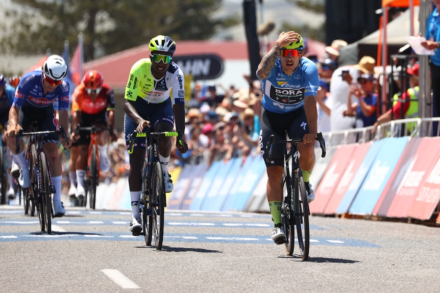 Sam Welsford holds his head