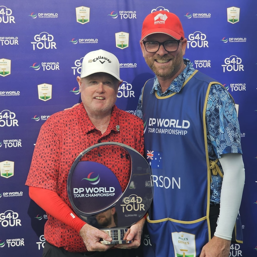 Trent Blucher and Steven Alderson holding a trophy