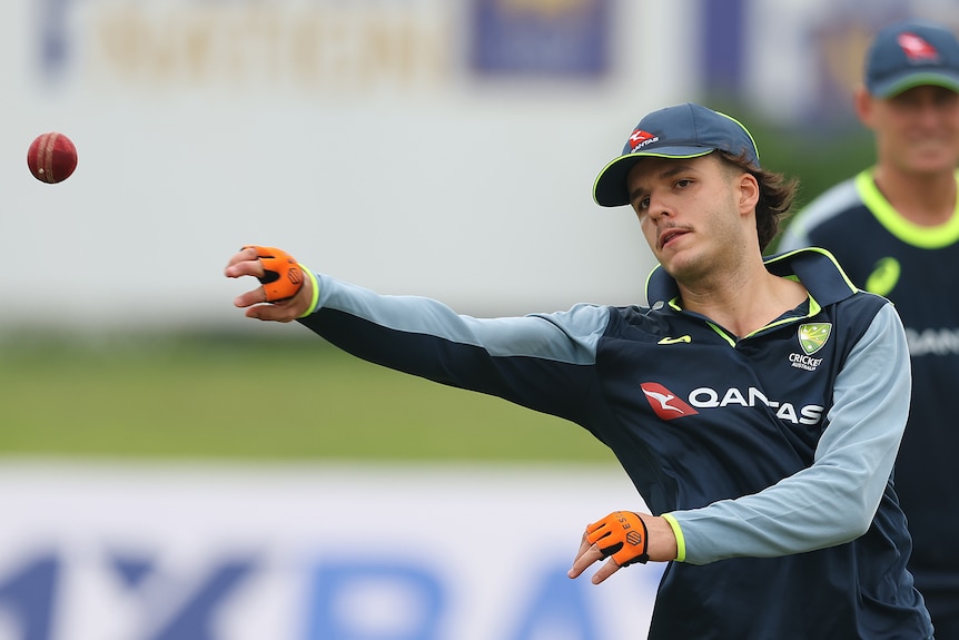 Sam Konstas of Australia fields during an Australia nets session, throwing the cricket ball