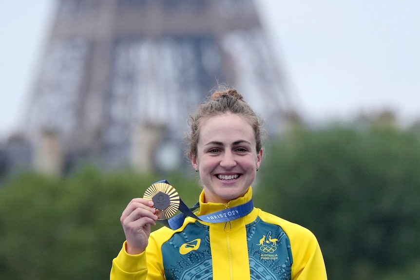 Grace Brown holds a gold medal