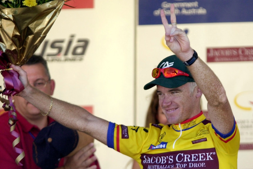 Stuart O'Grady holds up his hands