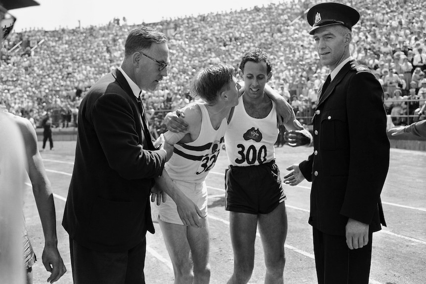 Roger Bannister and John Landy embrace after the mile at the 1954 British Empire Games.