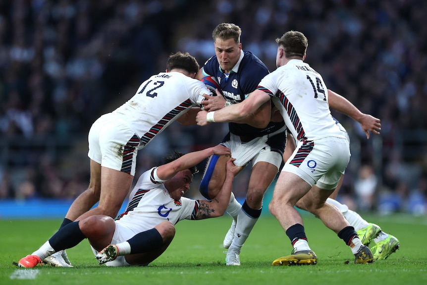 Duhan van der Merwe is tackled