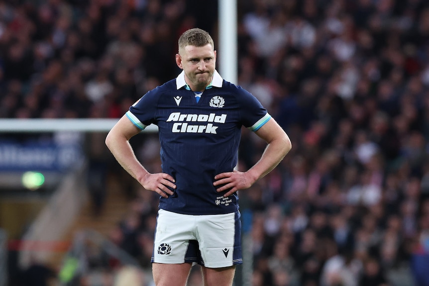 Finn Russell holds his hips