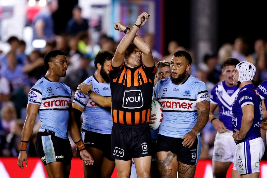 Connor Tracey of the Bulldogs is placed on report by referee, Chris Butler