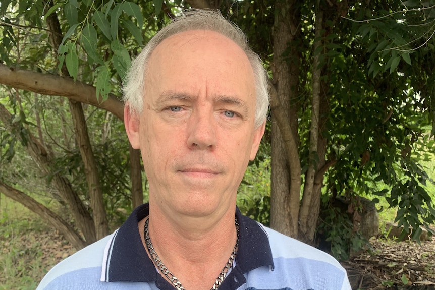 Jeffrey Addison wears a blue shirt.