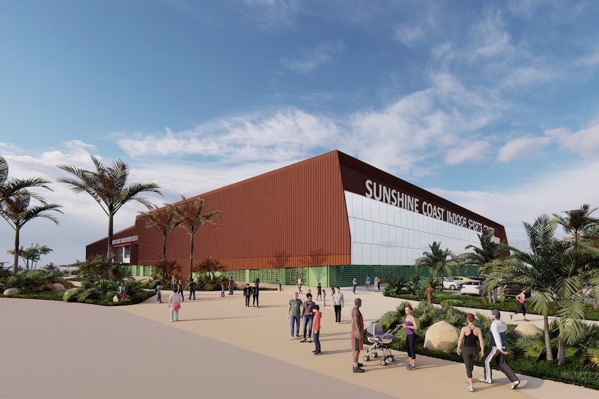 brown stadium with people walking on path