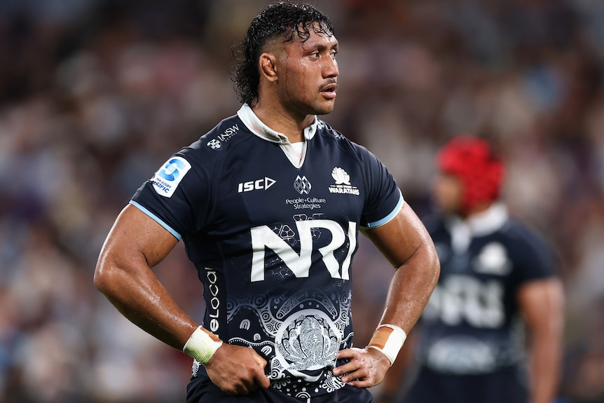 Rob Leota stands with his hands on his hips after a Waratahs-Drua match.