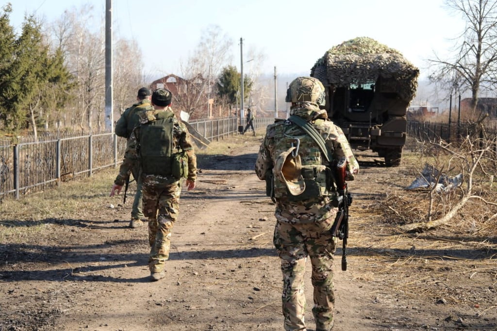 Russian service members on Friday walk along a street in the Kursk region, which was recently retaken by the Kremlin’s armed forces in the Ukraine war. Photo: Reuters Russian service members on Friday walk along a street in the Kursk region, which was recently retaken by the Kremlin’s armed forces in the Ukraine war. Photo: Reuters