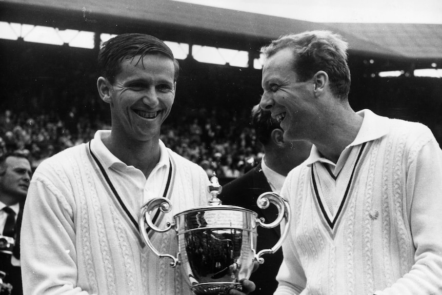 Roy Emerson smiles with Fred Stolle