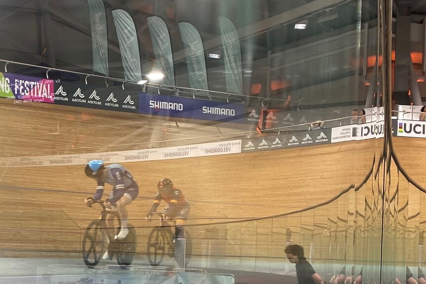 A blurred picture through the glass of two sprinters 