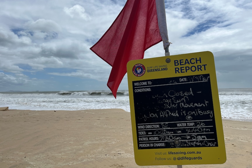 Sign on beach saying beach closed