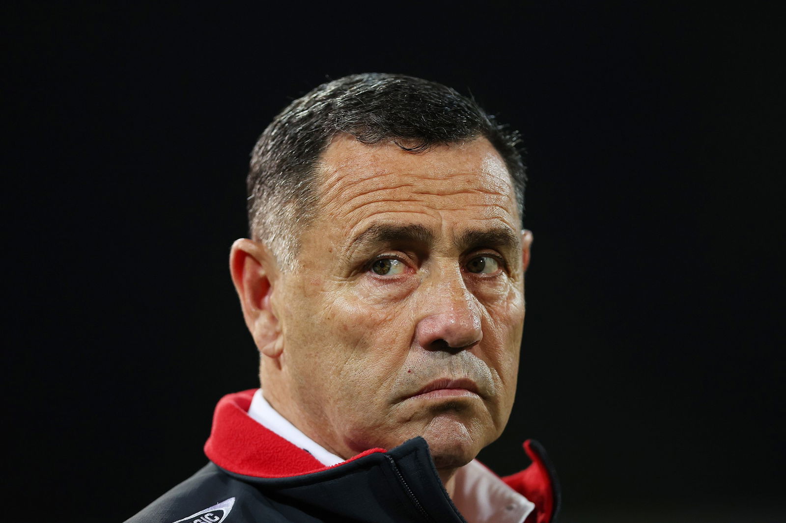 A middle aged man frowns