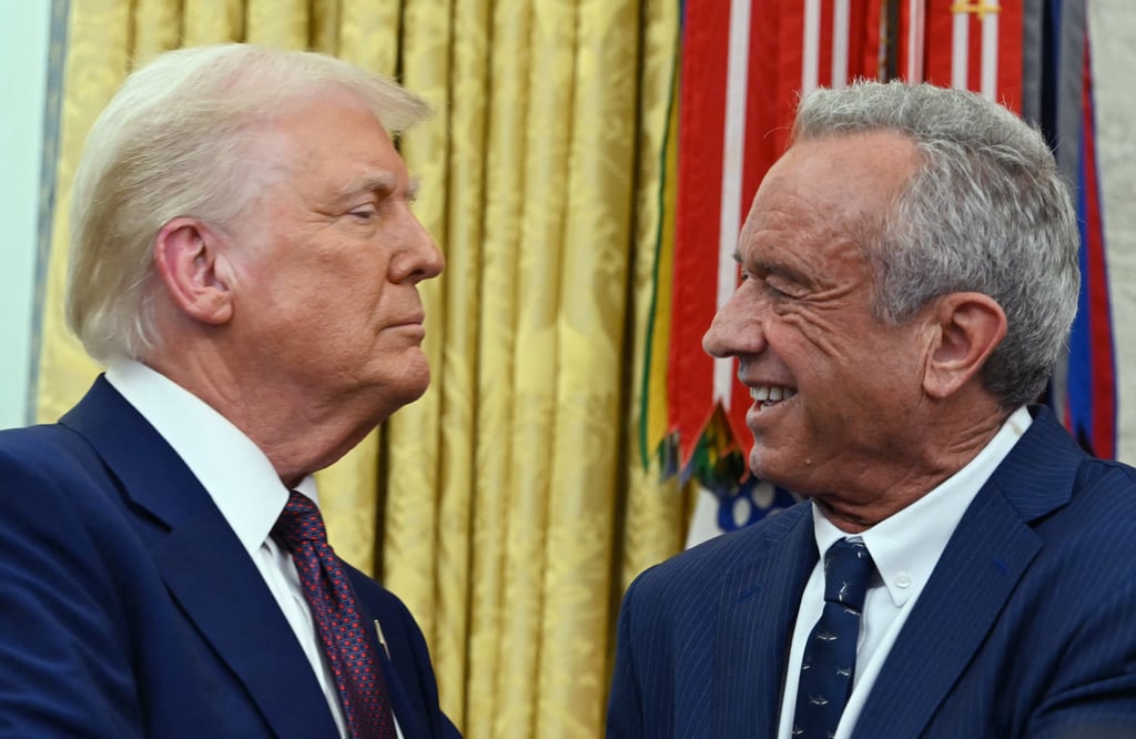 Robert F. Kennedy Jnr (right), the new US Secretary of Health and Human Services, shakes hands with US President Donald Trump after a swearing in ceremony in the Oval Office in February. Photo: TNS