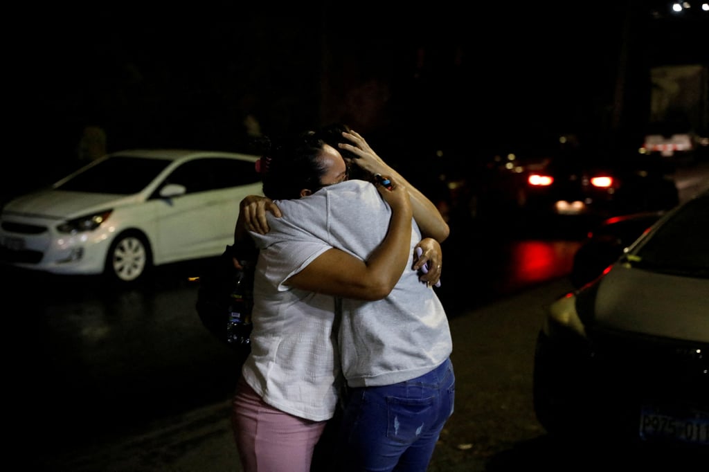 A Salvadoran migrant, who was deported from the United States, is embraced by her relative in San Salvador, El Salvador on February 26. Photo: Reuters