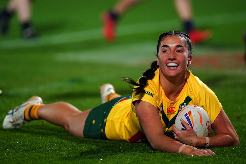 Olivia Kernick dives in for a try for Australia Jillaroos during a World Cup game.