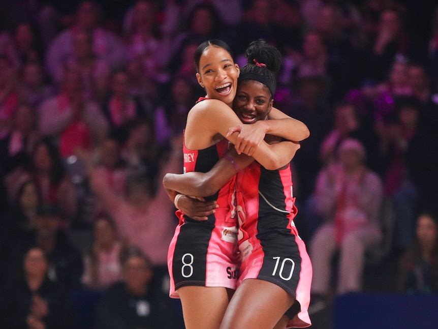 Two players hug