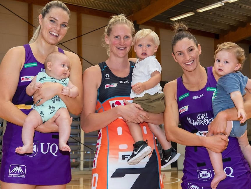 Three players each hold a baby