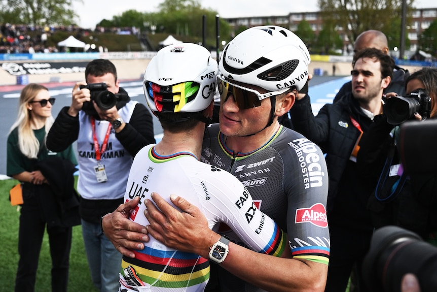 Tadej Pogacar and Mathieu van der Poel hug