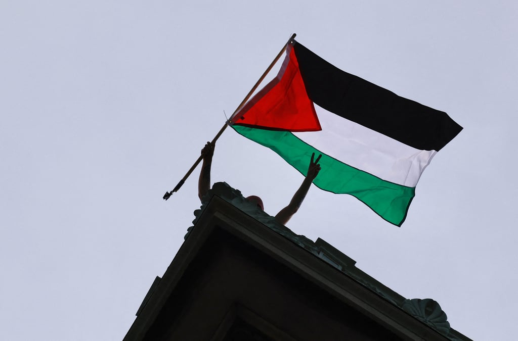 A protester waves a Palestinian flag during a demonstration at Columbia University in New York in April 2024. Photo: TNS A protester waves a Palestinian flag during a demonstration at Columbia University in New York in April 2024. Photo: TNS