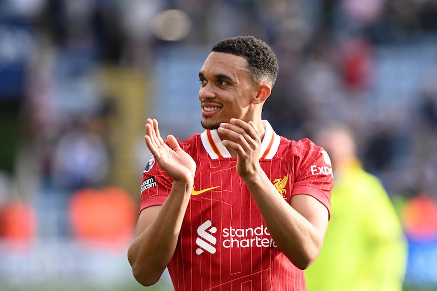 Trent Alexander-Arnold applauds the fans